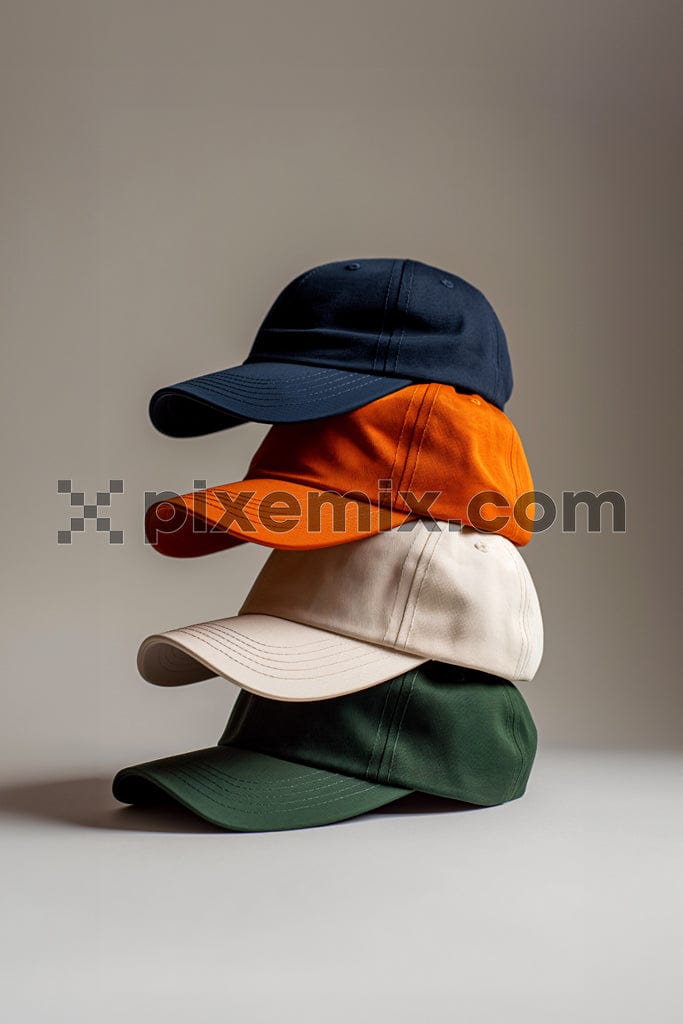 Set with stylish baseball caps on beige background image.