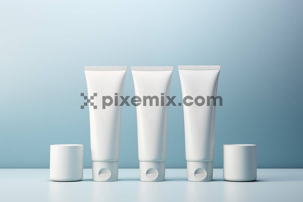 White cosmetic tube on blue background image.